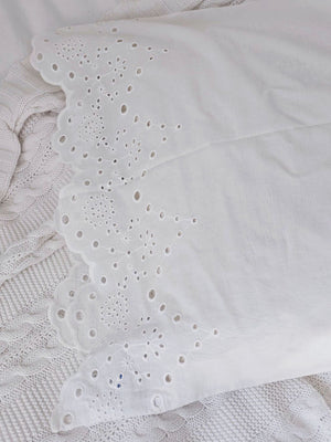 Our White Vintage Cotton Eyelet Lace Pillowcase brings shabby chic and farmhouse style together to create a dreamy white cottage bedroom. This ultra soft cotton pillowcase features scalloped edges with exquisite floral eyelet detailed trim. This lace edge pillowcase will add texture and a charming vintage look to your room.