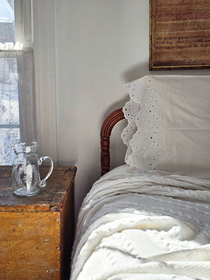 Our White Vintage Cotton Eyelet Lace Pillowcase brings shabby chic and farmhouse style together to create a dreamy white cottage bedroom. This ultra soft cotton pillowcase features scalloped edges with exquisite floral eyelet detailed trim. This lace edge pillowcase will add texture and a charming vintage look to your room.