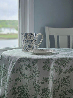 This charming White and Blue Floral Pitcher brings timeless farmhouse elegance to your kitchen or dining table. Crafted with a creamy white base adorned with delicate blue floral motifs, its classic pitcher silhouette evokes the warmth and simplicity of country cottage living. Perfect for serving beverages at gatherings, displaying fresh flowers, or adding a nostalgic touch to your home decor, this piece captures the heart of cottage style