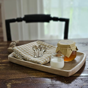 This rustic style Whitewash Wood Serving Board makes the perfect decorative tray for just about anything or any room. Keep soaps and lotions tidy on your countertop or keep your coffee table protected while using this tray to serve up snacks. We like to use it as a small place mat of sorts, to create a rustic table setting for small plates.  Features a rope handle for easy hanging storage. 13.8"L x 7.75"W x 1"H