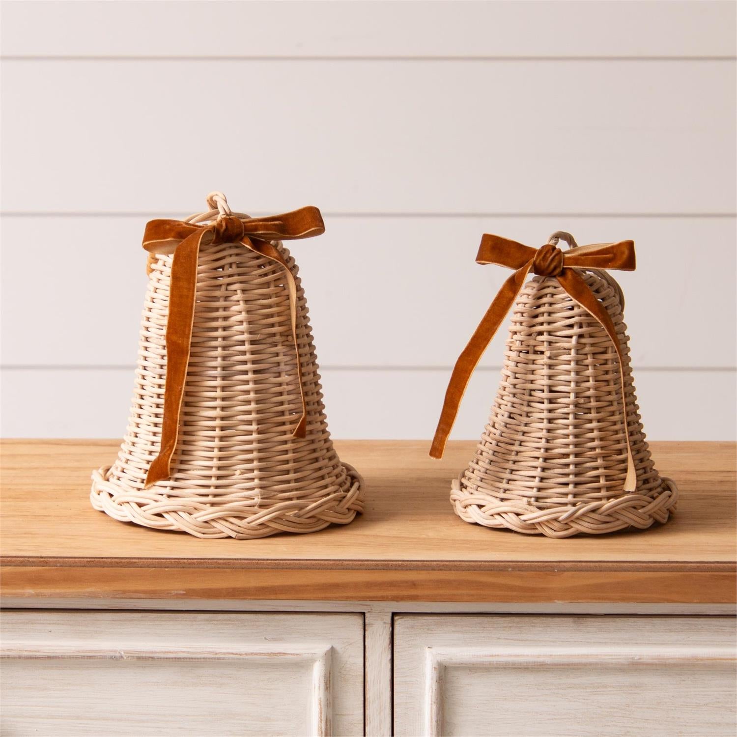 Experience the charm of the holiday season with our Wicker Bells with Velvet Bow. These festive decor pieces feature a cozy cottage feel and are accented with a beautiful mustard gold velvet ribbon bow. With hoops for easy hanging and sold in a set of two, these bells are the perfect addition to your holiday decor. Set of two