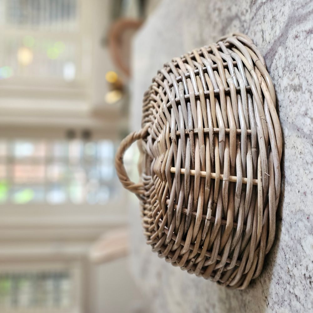 Bring cottage charm and French Country style to your dining table or patio with this Wicker Food Cover Cloche.&nbsp; Also known as a shoo-fly, this Wicker Cloche is perfect for protecting food from flies and other insects. It makes a stunning presentation while keeping food protected from the elements. This natural rattan cloche adds an elegant look to any occasion. 16" Diam x 7.5"H
