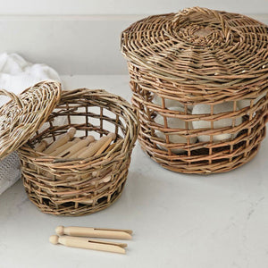 Bring a timeless country charm to your home with these Willow Baskets with Lids, Set of Two. Crafted from rich natural willow, these baskets are built with a classic English cottage feel and make a unique storage option for any farmhouse or cottage. They're perfect for seasonal greens and flowers and adding a vintage-inspired touch to any room. 9"H x 10" Diam, 7.5"H x 7.5' Diam