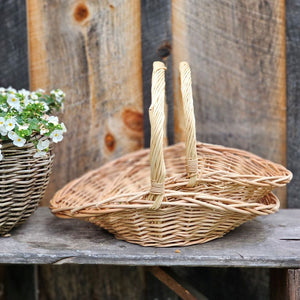 This Willow Gathering Basket Set adds a bit romance and style to the art of gardening and flower collecting. These low profile baskets are also perfect for picnics or keeping your home organized. The ageless beauty of natural fibers are woven together to make these functional, yet beautiful wicker baskets ready to be your workhorse. Create stunning farm table centerpieces by adding your favorite fruits and flowers. English cottage style with functionality at its best. Set of two.