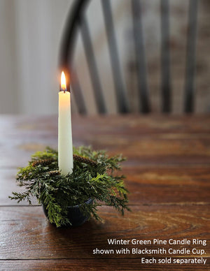 Our Winter Green Pine Candle Ring brings fresh, earthy greenery to your farmhouse decor. Perfect for adding cabin style or a rustic twist to taper candle holders and chandeliers, this faux pine candle ring will provide a charming decorative accent all year long. Number of pine cones may vary.