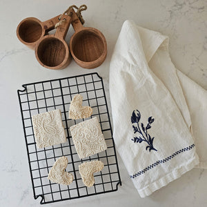 Elevate your baking game with our Wire Bakers Cooling Rack. Not only does its open weave design make for faster cooling, but it also doubles as a stylish trivet to protect your surfaces. Whether it's for cooling or serving, this rectangular wire rack is a must-have for any kitchen. 10"L x 7.2"W x 1"H
