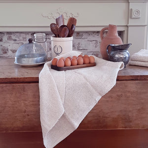 Inspired by antique egg holders, such as ones spotted in the Downton Abbey kitchen,  our farmhouse Wood Egg Tray will be right at home in your kitchen. It makes a great accent for any shelf or countertop. The rustic wood egg crate holds 12 eggs. Eggs not included. 