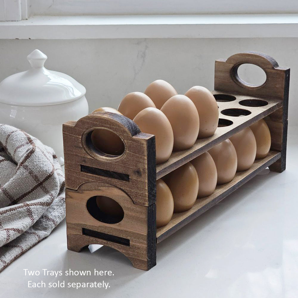 Inspired by antique egg holders, such as ones spotted in the Downton Abbey kitchen, our farmhouse Rustic Wood Stackable Egg Tray will be right at home in your kitchen. It is sold as one tray, and a purchase of two gives you that old-timey stackable look. Makes a great accent for any shelf or countertop. Each rustic wood egg crate holds 12 eggs. Eggs not included. Includes one tray. Purchase two or more for stacking. Made in the USA. 12"L x 3"W x 3.5"H