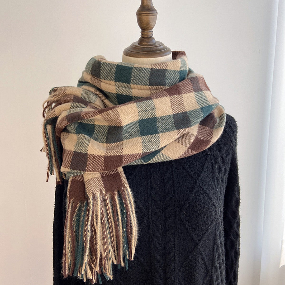 Our thoughtfully designed Woodland Plaid Scarf is an exceptionally soft and cozy knit wrap. This scarf is the perfect travel companion, offering warmth and convenience on the go. It effortlessly elevates any outfit, whether you're lounging at home or exploring while on the go. Made from a cashmere blended acrylic. Hand wash. 27.5"×78.7"