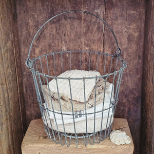 Wire baskets have a way of adding vintage farmhouse style to any room. The Aged Wire Clam Basket is inspired by antique clam baskets, used to shellfish for centuries. This multipurpose basket is perfect for storing just about anything. It can even be turned into a pendant lampshade by simply adding a hanging lamp cord. Keep apples and potatoes stored in the pantry,  corral small toys, or keep bathroom towels on display. 