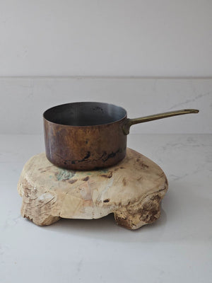 The Chapati Board is a long-standing household necessity in homes across India. These authentic, refurbished Vintage Bleached Chapati Boards take a modern turn as a home accent. No two are alike. These round wood slabs with small legs make unique farmhouse display pedestal risers. Use as a trivet or to display candles, plants and more. They're rich history leaves the wood with cracks and aged patinas. 