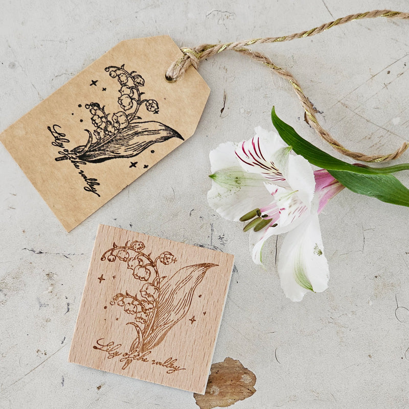 Create magical place cards, gift tags and more with our Botanical Wooden Stamps. Made of wood and rubber these stamps feature botanical illustrations. Select your choice of Poppy, Tulip, Daisy, or Lily of the Valley. Stamp only. Gift tags not included. Sizes range from 2" x 2", 1" x 3.2" and 1.2" x 3.2" 