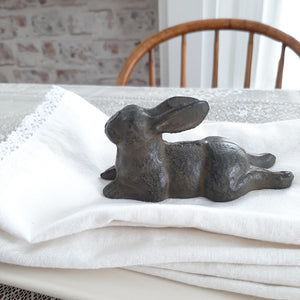 Our Cast Iron Lazy Bunny makes a sweet accent. This little relaxing bunny snuggles perfectly onto any shelf or tabletop. With its aged finish, it adds vintage charm to any room. 5"L x 2"W x 2.5"H