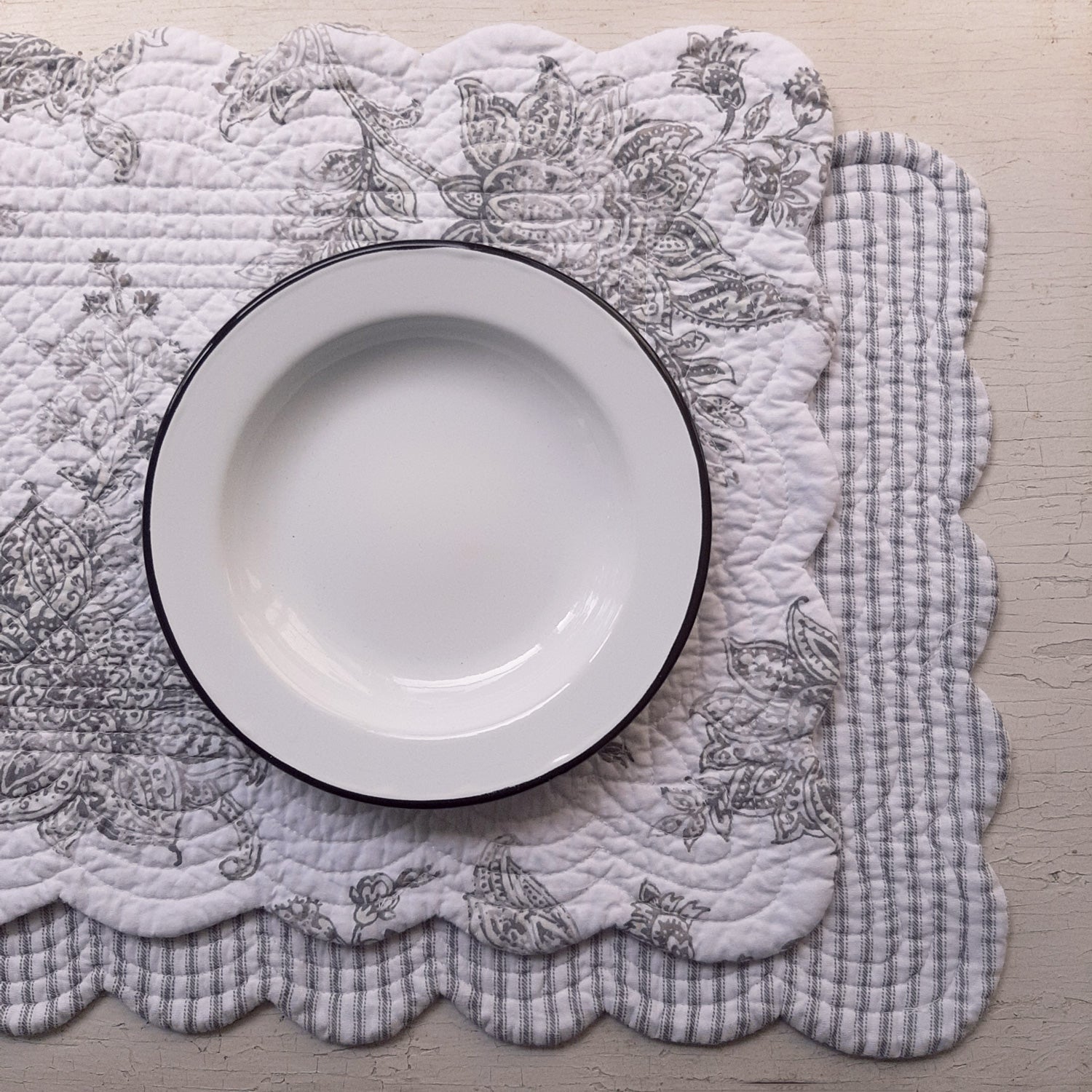 https://farmhousewares.com/cdn/shop/products/Charcoal-Ticking-Stripe-and-Toile-Placemat-enamel-plate_fbfe84e3-4bfb-4db0-8859-d5d867f81325_2048x.jpg?v=1690643449