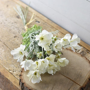 You know summer is in full swing when the coreopsis is in bloom. These daisy-like blossoms create a relaxed wildflower style bouquet, as if they have just been plucked from a countryside meadow.  This sweet White Coreopsis Bouquet features eight stems with faux creamy white flowers and greens that have a dusty-grey/green appearance. 