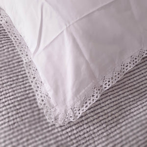 Our Prairie Pillow Sham features a sweet crochet lace trim and crisp white cotton. Inspired by vintage bedding, this cotton sham get softer and prettier with every wash. Create instant cottage style or a dreamy farmhouse bedroom with this Prairie Pillow Sham.  Made with 100% cotton, our crochet lace Prairie Pillow Sham has a vintage cotton quality that is soft and breathable without static cling.