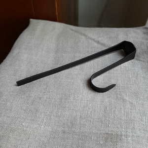 Add a primitive, antique touch to your hutches and cupboards, with this Cupboard Door Hook. This metal hook features a painted matte black finish. Hook hangs over cupboard doors and it can be used to hang a number of items around a home. It's perfect for hanging dish towels for an old farm kitchen look. Hang dried flowers, hand-dripped candles or wreaths around the holidays.