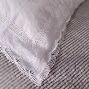 Our Embroidery and Lace Pillow Sham lends a sweet cottage style and create instant vintage charm. This crisp-white sham  features beautiful edging all around with detailed lace and delicate embroidered flowers. This lace edge sham will add texture and a charming vintage look to your room.  Made with 100% cotton, our Embroidery and Lace Pillow Sham has a vintage cotton quality that is soft and breathable without static cling.