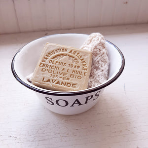 Our White Enamel Soap Bowl has a nostalgic quality that's perfect for a vintage style bathroom or guest room. The distressed white enamelware with black trim is classic farmhouse style.