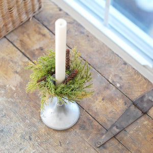 Our Forest Pine Candle Ring brings fresh, earthy greenery to your farmhouse decor. Perfect for adding cabin style or a rustic twist to taper candle holders and chandeliers, this set of two will provide a charming decorative accent all year long. Set of Two. 6” Diam with 2”inner
