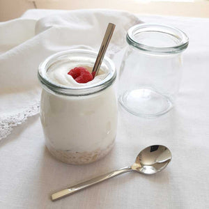 Our French Yogurt Jars and Demitasse Spoon Set inspires a new way to look at canning, dessert making and more. Perfect for jams, jellies, homemade baby food, parfaits, pudding treats and mini pies…the uses are endless.  The set includes two glass French Yogurt Jars, two Lids for airtight freshness, and two Stainless Steel Demitasse Spoons with sleek, minimalist style