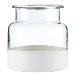 Our Glass Jar Vase with White Base brings vintage and modern farmhouse style together. This glass jar looks great on kitchen and pantry shelves or on bathroom vanities, holding cotton balls and swabs, soaps and salts. This glass jar canister has a vintage shape with a matte white finish along the bottom. 5.5” diam x 6”H
