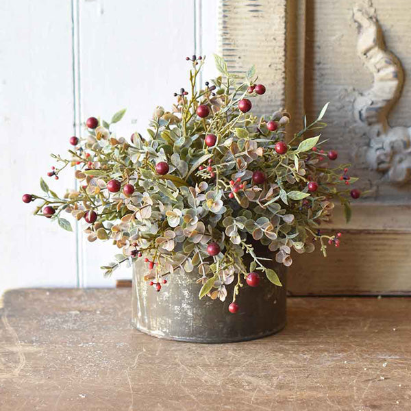 Add a rustic touch to any bowl, basket or pot with our Red Berries and Eucalyptus Half Sphere. The soft, muted grey/green tones of this Eucalyptus combined with Red Berries lends an earthy charm to any room in your farmhouse. This faux half sphere sits easily in any bowl or basket to create a farm table centerpiece that will look beautiful in any season. 10” Diam (Floral Sphere Only. Galvanized Tin Not included.)