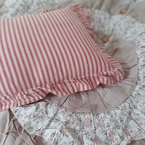 Add instant vintage charm to any room with our Red Ticking Stripe Accent Pillow. The ruffled edges lend a sweet cottage feel. County red and tan ticking stripes give this accent pillow timeless style. Includes two wood buttons on the back for easy removal. 100% Cotton. Machine Wash. Includes pillow insert. 22"L x 14"H