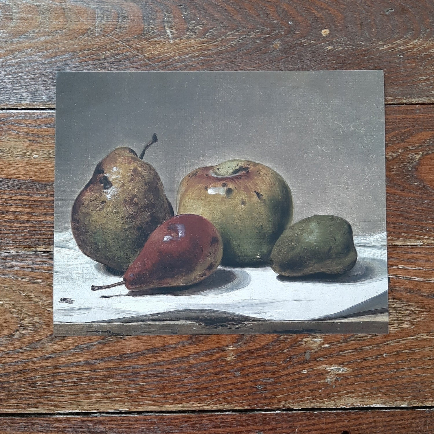 This Vintage Art Print, Still Life with Fruit adds an enchanting charm to any room. Maroon, browns, and dark greens blend together to create this dreamy still-life. The art is printed on high quality card stock with archival ink. Original art has been digitally retouched to preserve characteristics, grain and cracks. Image size: 10"x 8". Print only. No frame included.