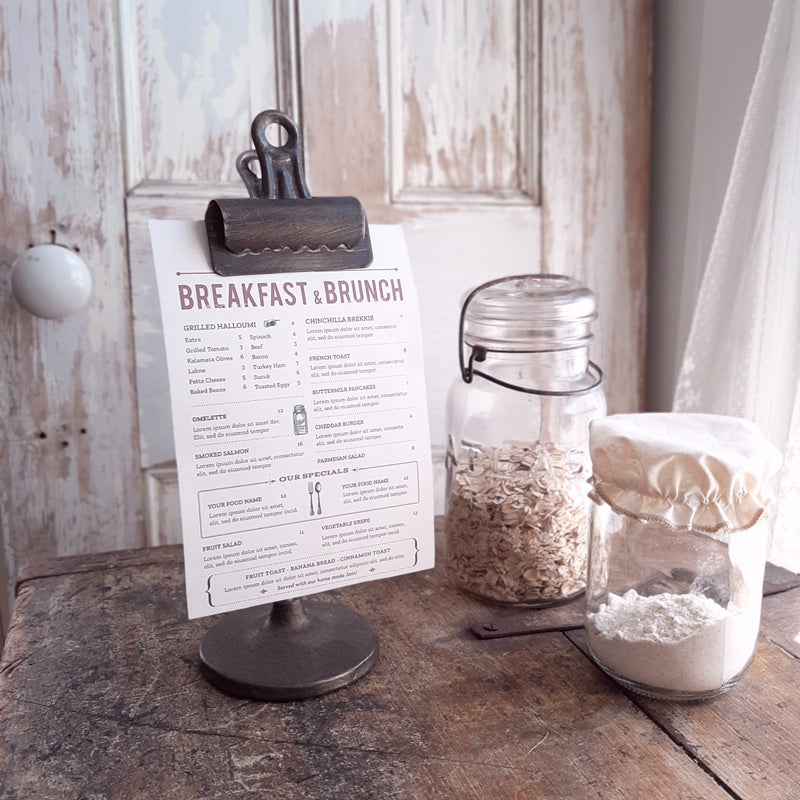 Industrial style clips are given a leg up on display when mounted on cast iron bases. Our Vintage Style Bookkeepers Clip on Stand is perfect for photos, a menu, a memo, or to hold table numbers at a reception. This vintage style clip has a perfectly aged patina and can be used in so many ways.  3.5x3.5x10.5