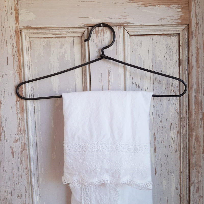 Add a vintage touch to your laundry room or entryway coat closet with this Vintage Style Wire Hanger. The antique industrial feel of this sturdy wire clothes hanger offers a nostalgic twist on this basic staple of every day farmhouse living. 14.5"L x 6"H