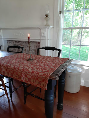 Influenced by vintage Welsh tapestry patterns, this Welsh Inspired Table Square adds instant warmth and character to any room. The pattern features burnished red woven with a dark beige and warm grey. Table squares are perfect for protecting wood tables or even larger tablecloths. They're great for adding a bit of charm for smaller tables.