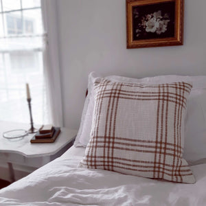 This Wheat and Cream Plaid Pillow Cover lends a bright and fresh farmhouse look to any room. This sweet Wheat and Cream Pillow Cover is crafted of 100% cotton with wood button details on the back. This accent pillow is ideal for layering and lounging. Product dimensions: 18" x 18". Pillow Cover Only (Insert not included) 