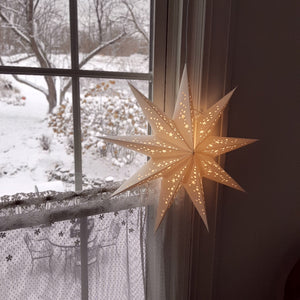 Create an enchanted glow in any room with this White Paper Star Light. Its simple design is perfect for a minimalist style farmhouse. Each star is handmade and comes preinstalled with a thin, clear 12-ft cable, an energy saving LED bulb and a 5V AC Adapter. 