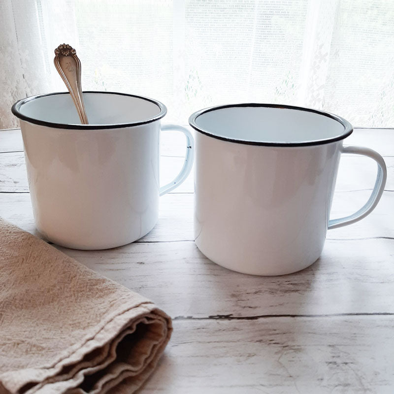 https://farmhousewares.com/cdn/shop/products/White-enamel-mugs-8_1600x.jpg?v=1594132959
