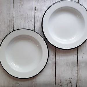These White Enamel Salad Plates bring vintage style no matter the season. This set of two white enamel plates includes black rims to emulate those found in antique shops. Their size makes them perfect for layering on top of dinner plates for a pop of color.  Item is food, oven and dishwasher safe. Set of two.  Measures 8" in diameter. Do not microwave.