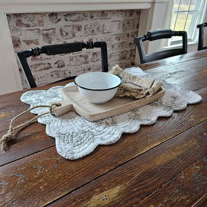 This rustic style Whitewash Wood Serving Board makes the perfect decorative tray for just about anything or any room. Keep soaps and lotions tidy on your countertop or keep your coffee table protected while using this tray to serve up snacks. We like to use it as a small place mat of sorts, to create a rustic table setting for small plates.  Features a rope handle for easy hanging storage. 13.8"L x 7.75"W x 1"H