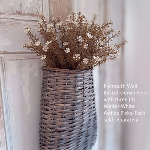 The Winter White Astilbe Spray adds a faded vintage charm to any room. This faux floral gives the appearance of dried flowers and offers a nod to the garden all year long. It easily fits into baskets, buckets, and milk cans and more. 10” high by 5” wide.