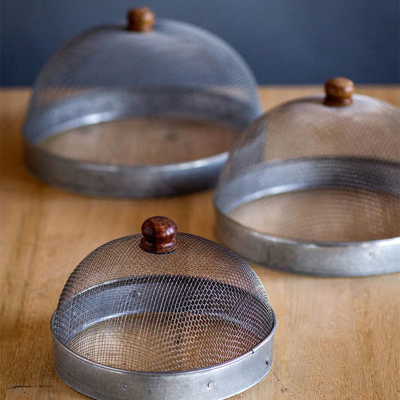 A screen cloche, also known as a shoo-fly, is perfect for protecting food from flies and other insects.  Our set of three Wire Mesh Food Covers has tons of vintage charm and offers a range of sizes. The small one is perfect for keeping butter and other small items covered.