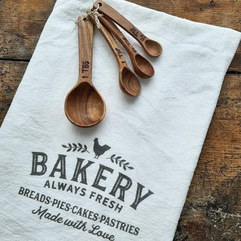 https://farmhousewares.com/cdn/shop/products/Wood-Measuring-Spoons-with-Bakery-Flour-Sack_2048x.jpg?v=1612366711