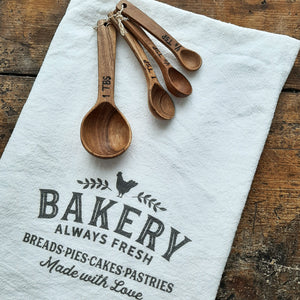 Bring rustic farmhouse style to your cooking with this Wood Measuring Spoon Set. These handmade wooden measuring spoons are so nice you won't want to use them and get them dirty! This set will complement any kitchen. Made of laurelwood, each is unique, no two are exactly alike! Handmade and fair trade. Includes: 1 tbs, 1 tsp, 1/2 tsp, 1/8 tsp. Full set is 5"L x 1.5"W