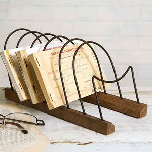 Our Wood and Wire Plate and Letter Rack is a versatile piece. Display small dessert plates on a buffet for rustic style farmhouse entertaining or organize letters, cards and other papers. Features a wood base and metal loops. 4.5"W x 9.5"D x 4.5"H (Recommended for small plates only. Shown here with 7.5” Diam plates, not included.) 
