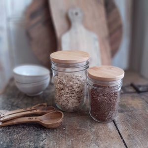 Our Wood Mason Jar Lids are ideal for creating rustic style home and kitchen organization. The Wood Mason Jar Lids easily push into place onto your choice of regular mouth or wide mouth Mason jars. These solid bamboo lids are perfect for all your dry storage needs! 